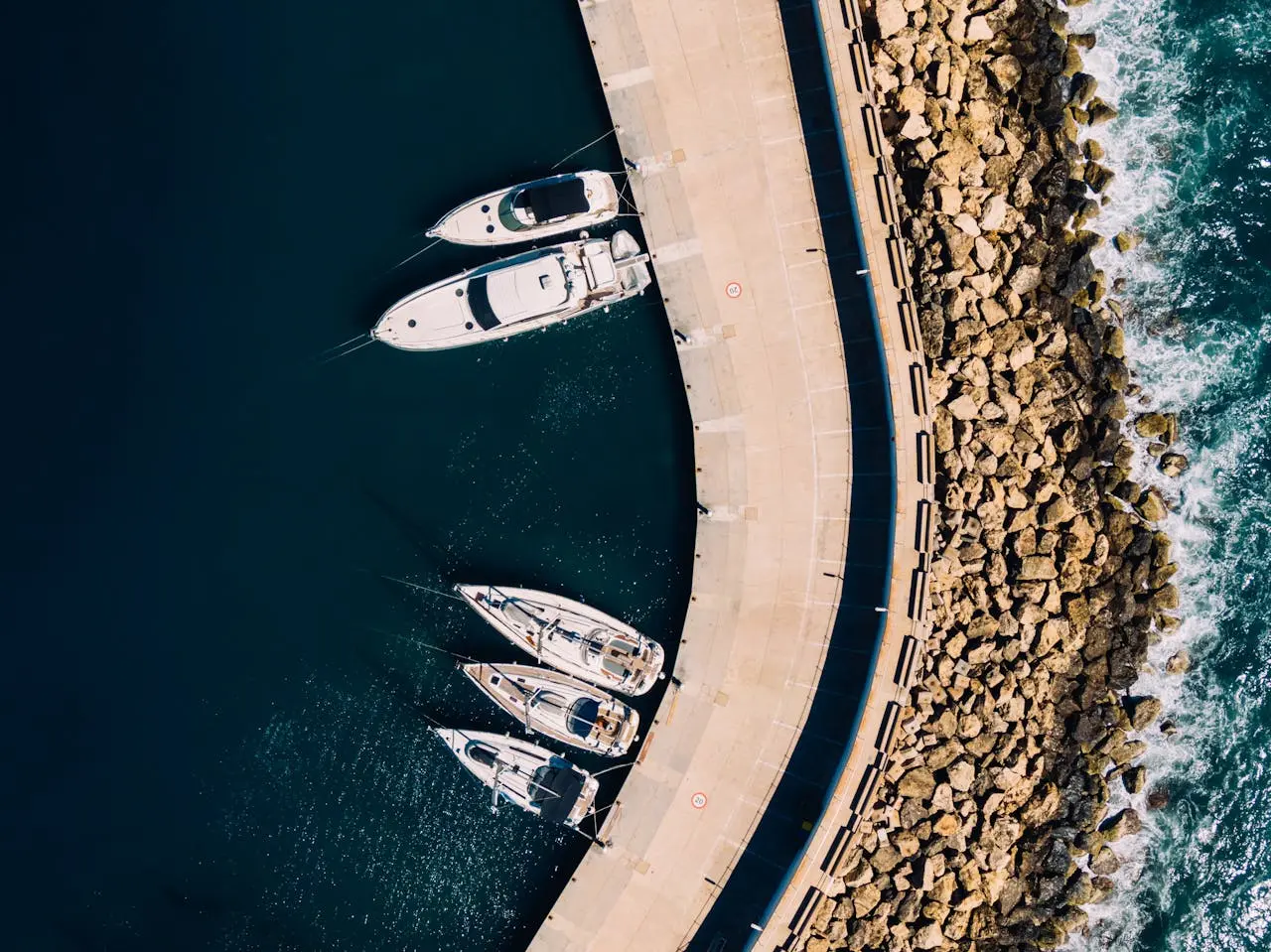 The yacht is docked at the marina