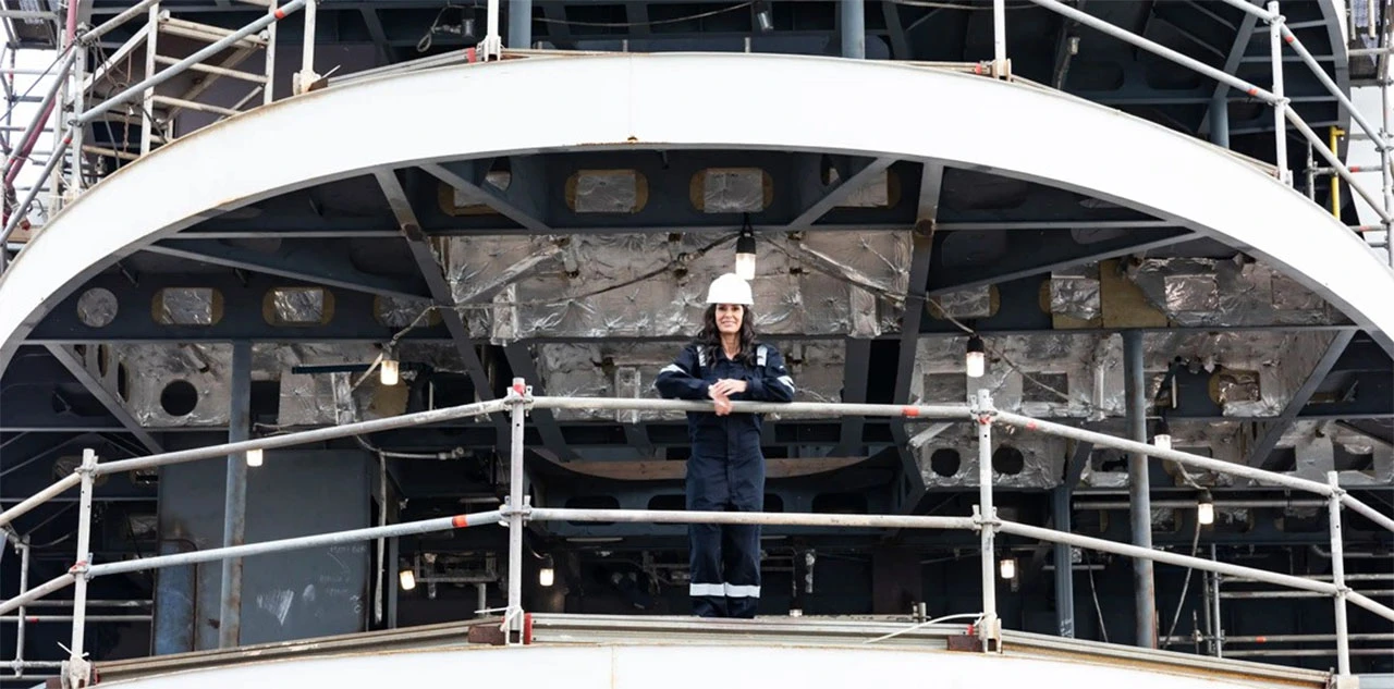 Captain McCue standing on the yacht